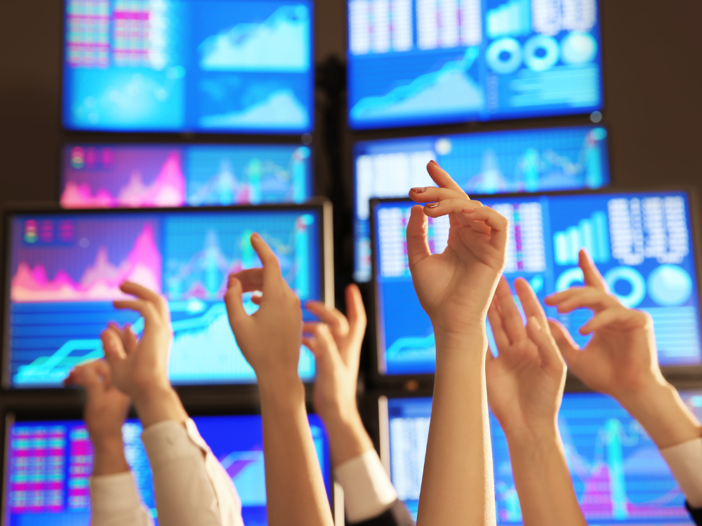 Hands raised at a stock exchange